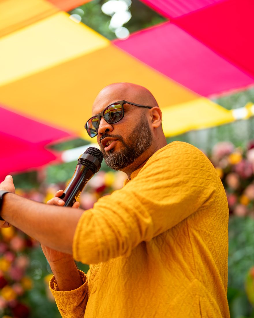 EMCEE Sunil hosting an event on stage with a microphone in Bangalore